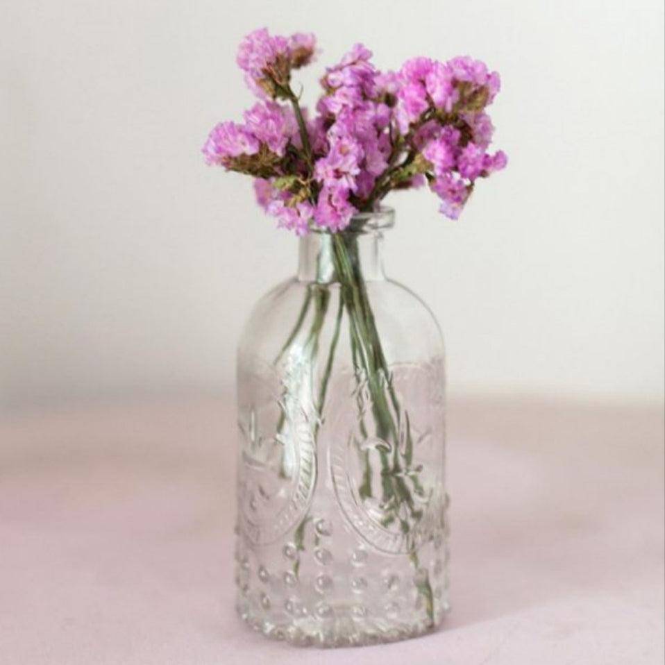 Vintage Embossed Clear Glass Bottle